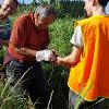 Johnny, Uncle Timo and TJ wrestling a stubborn cabbage tree from it's pot.